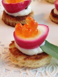 Beet pickled quail egg with salmon roe